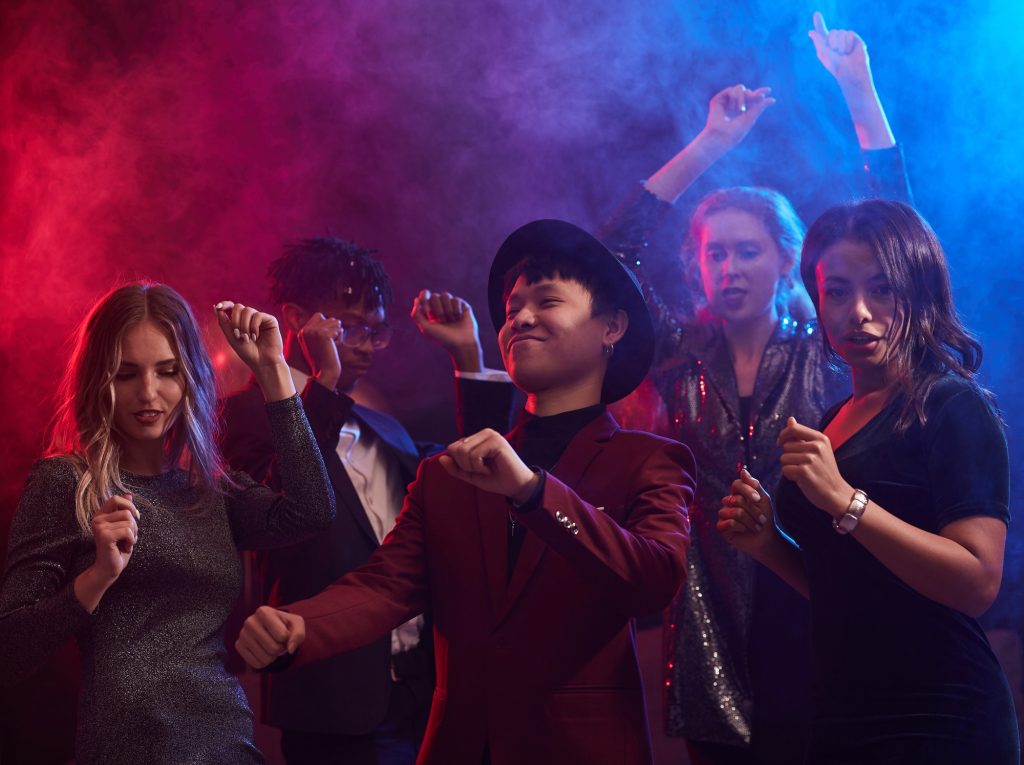Live OPM band performance at Filipino nightclub in Dubai with crowd singing and vibrant stage lighting at Terrasse Club